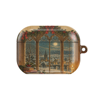 Christmas Library Window AirPods case — arched library window with snowfall, candle, holly and old books, closed front view