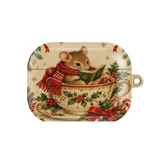 Teacup Mouse AirPods case — tiny mouse in a red scarf reading a book inside a holly teacup, closed front view