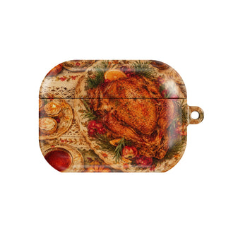 Thanksgiving Table AirPods case — top-down Thanksgiving feast with turkey, pie and candles, closed front view