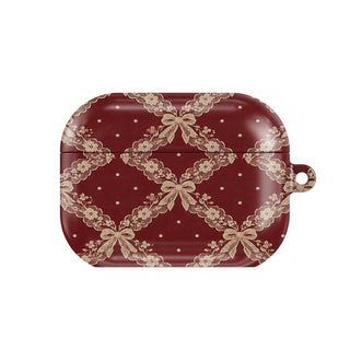 Burgundy Lace AirPods case — blush lace trellis with ribbon bows on burgundy, closed front view