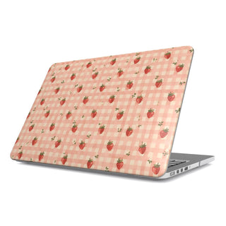 Strawberry Gingham MacBook case — little red strawberries on peach gingham, hard-shell laptop cover, angled lid view