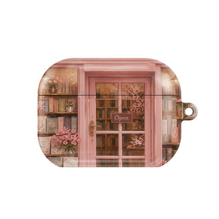 Cherry Blossom Bookshop AirPods case — bookish, closed front view