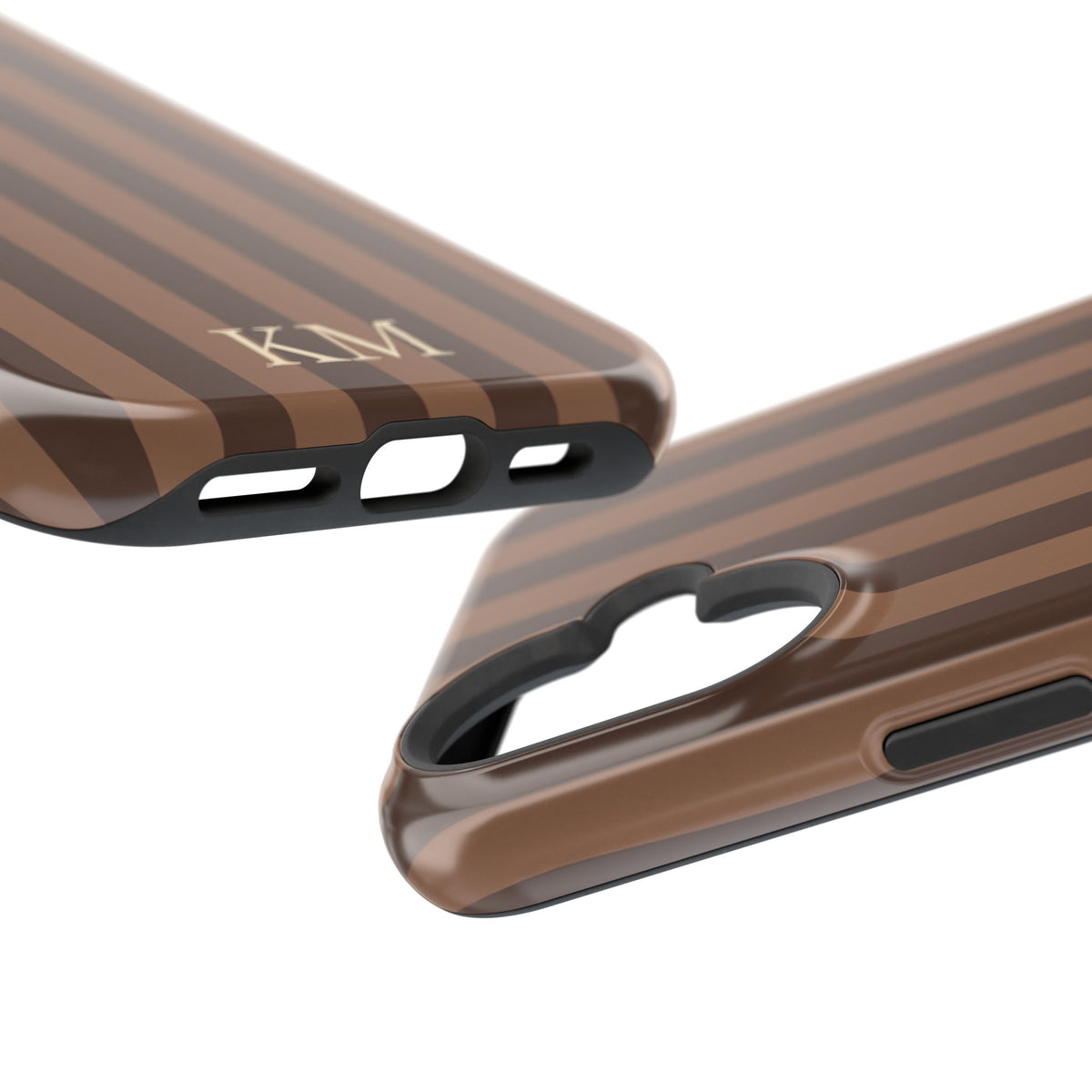 Close-up of printed initials on a brown striped phone case