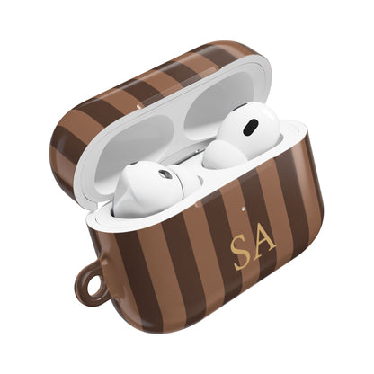 Brown stripe AirPods Pro case open — gold initials on the front