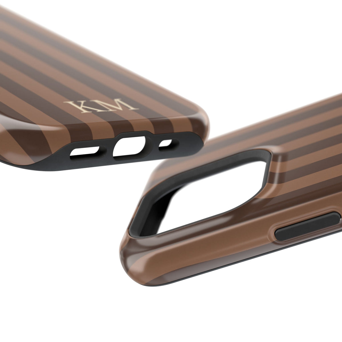 Monogrammed stripe phone case held in one hand