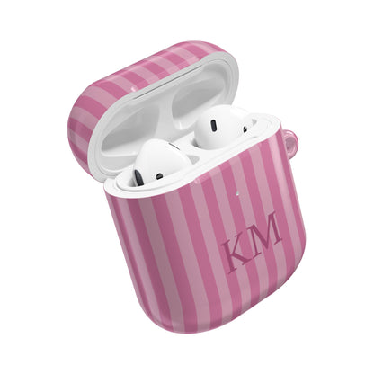 Pink stripe AirPods case open with AirPods inside — custom initials