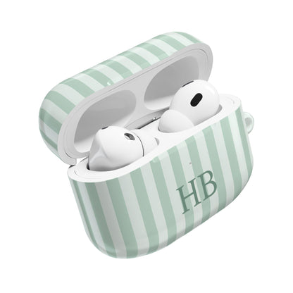 Sage Stripe monogram AirPods case open with AirPods inside — glossy polycarbonate