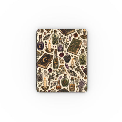 Witchy apothecary iPad folio open on its stand, cream botanical print with black Saffiano back