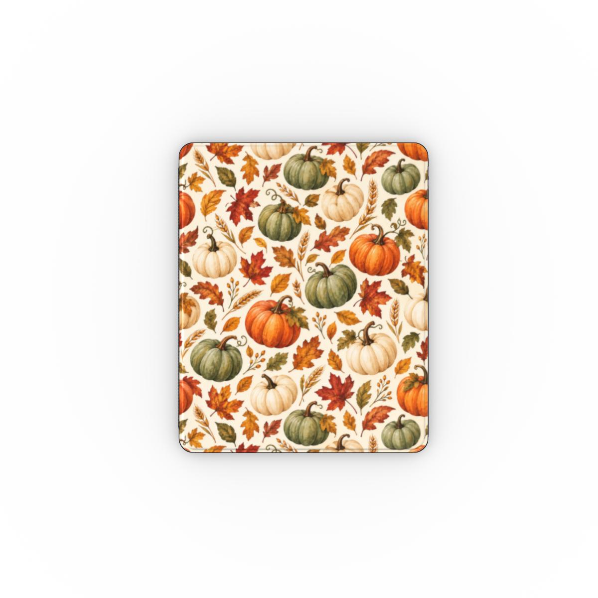 Watercolor pumpkin iPad folio open on its stand, cream autumn print with black Saffiano back