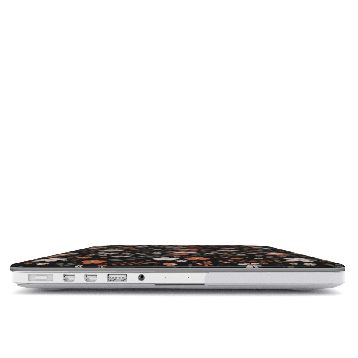 Dark Ditsy Floral MacBook case — hard-shell laptop cover, side view with ports
