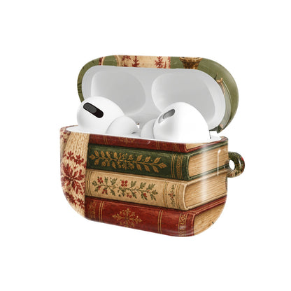 Christmas Book Stack AirPods case — hard-shell earbuds cover, open angled view