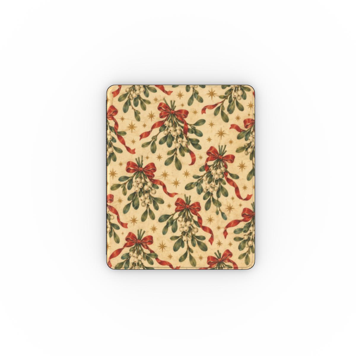 Mistletoe & Ribbons iPad case — mistletoe sprigs tied with red ribbon bows on aged cream