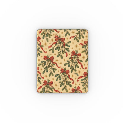 Mistletoe & Ribbons iPad case — mistletoe sprigs tied with red ribbon bows on aged cream