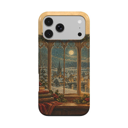 Christmas Library Window phone case — arched library window with snowfall, candle, holly and old books, MagSafe iPhone case, front view