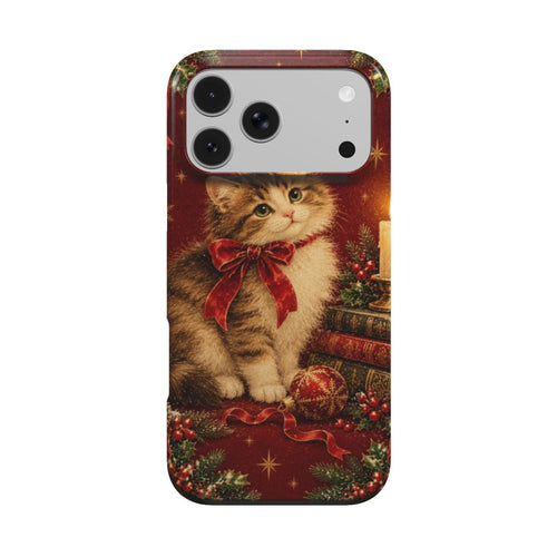 Christmas Cat phone case — fluffy kitten with a red bow beside a candle and stack of books, MagSafe iPhone case, front view