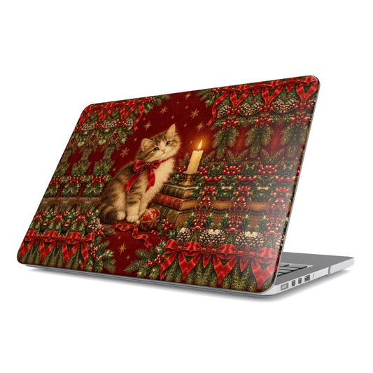 Christmas Cat MacBook case — fluffy kitten with a red bow beside a candle and stack of books, hard-shell laptop cover, angled lid view