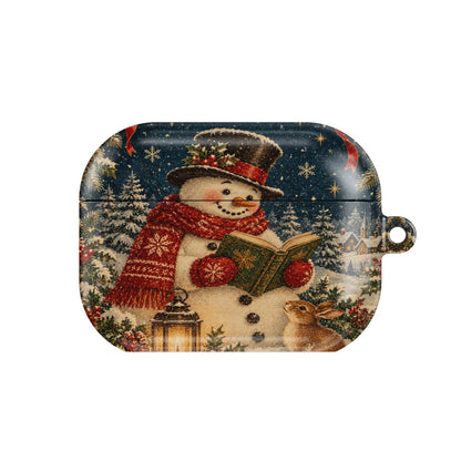 Reading Snowman AirPods case — snowman in a top hat and red scarf reading a book under the stars, closed front view