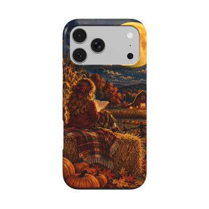 Harvest Moon Reader phone case — girl reading on a hay bale under a glowing harvest moon, MagSafe iPhone case, front view