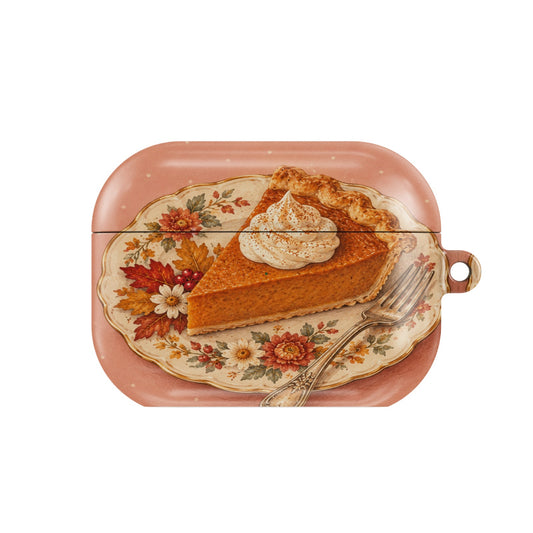 Pumpkin Pie Slice AirPods case — slice of pumpkin pie with whipped cream on a floral plate, closed front view