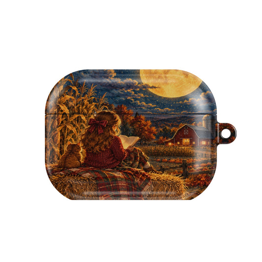 Harvest Moon Reader AirPods case — girl reading on a hay bale under a glowing harvest moon, closed front view