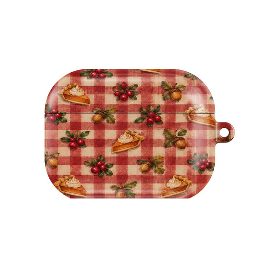Cranberry Gingham AirPods case — cranberry sprigs, acorns and pie slices on red gingham, closed front view