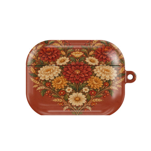 Grateful Hearts AirPods case — folk-art heart of dahlias, mums and wheat on terracotta, closed front view