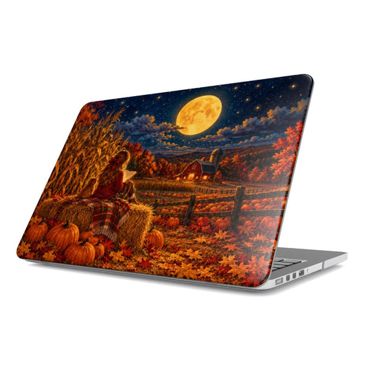 Harvest Moon Reader MacBook case — girl reading on a hay bale under a glowing harvest moon, hard-shell laptop cover, angled lid view