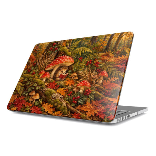 Mushroom Forest MacBook case — hedgehog reading under red mushrooms on a mossy forest floor, hard-shell laptop cover, angled lid view