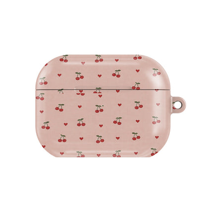 Cherries & Hearts AirPods case — little red cherries and hearts on blush pink, closed front view