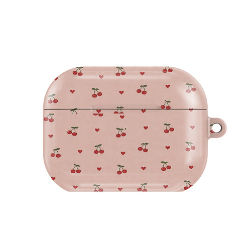 Cherries & Hearts AirPods case — little red cherries and hearts on blush pink, closed front view