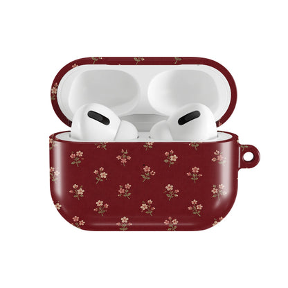 Burgundy Ditsy Floral AirPods case — open front view