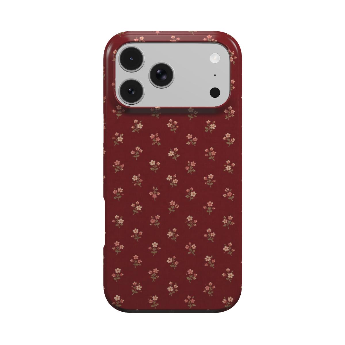 Burgundy Ditsy Floral phone case — tiny cream flower sprigs on deep burgundy, MagSafe iPhone case, front view