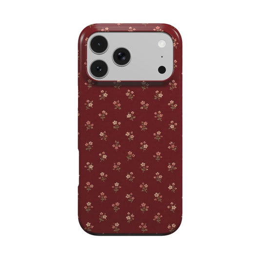 Burgundy Ditsy Floral phone case — tiny cream flower sprigs on deep burgundy, MagSafe iPhone case, front view