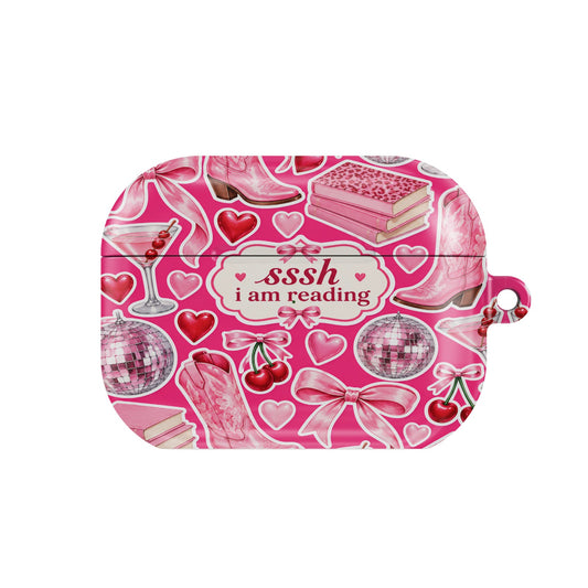 Sssh I Am Reading AirPods case — pink bookish, closed front view