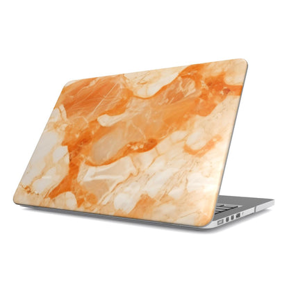 Apricot Marble MacBook case — warm coral, hard-shell laptop cover, angled lid view