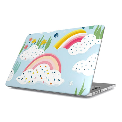 Rainbow Meadow MacBook case — rainbow sky, hard-shell laptop cover, angled lid view