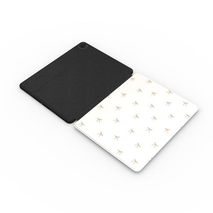 Taupe Bows iPad case opened flat — printed front cover with plain black interior