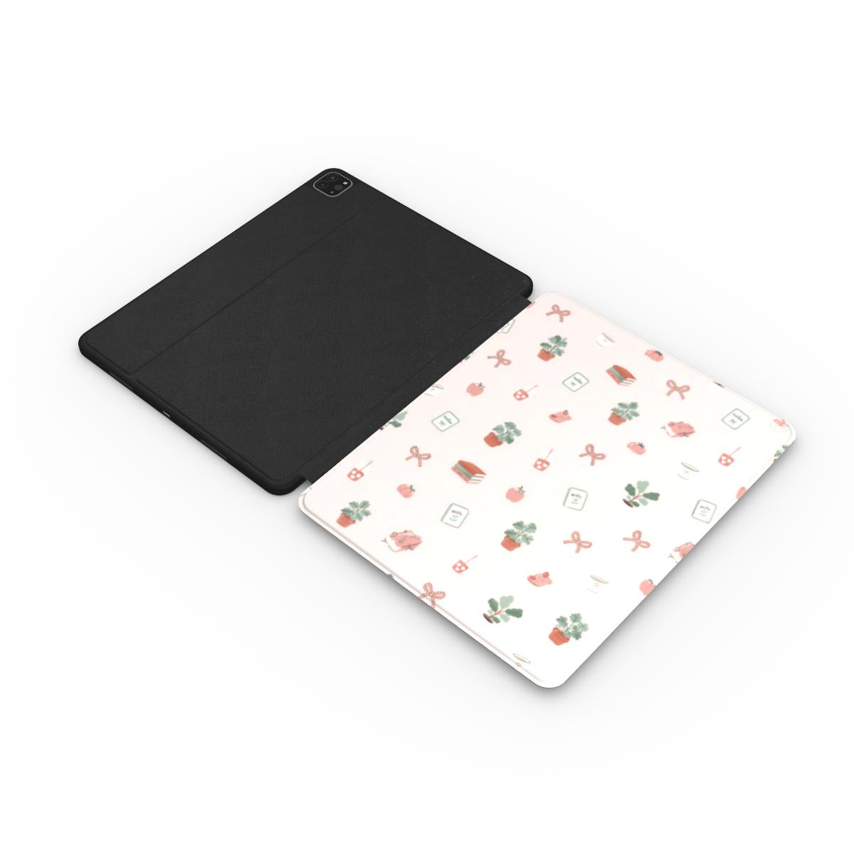 Cottage Bookish Doodle iPad case opened flat — printed front cover with plain black interior