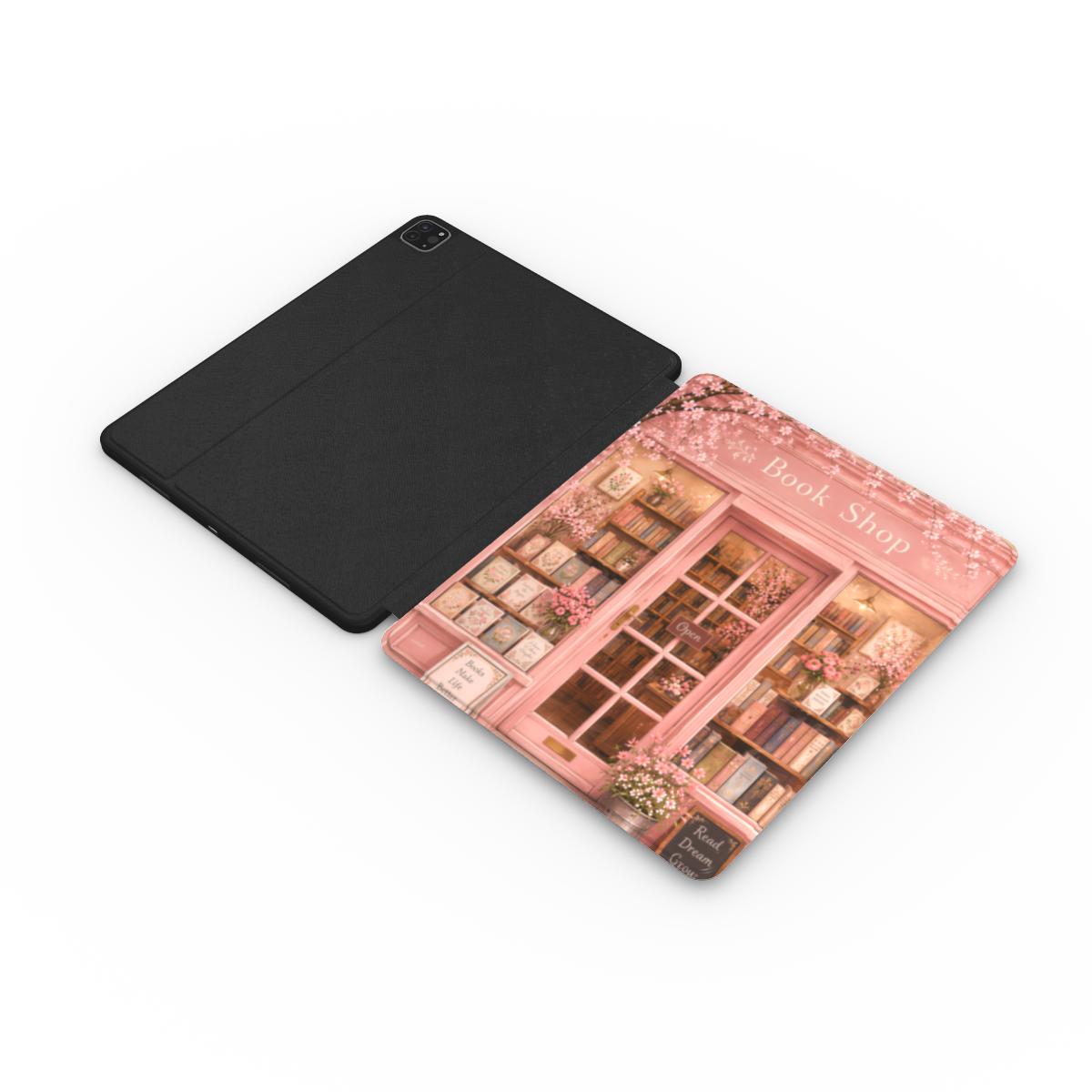 Cherry Blossom Bookshop iPad case opened flat — printed front cover with plain black interior