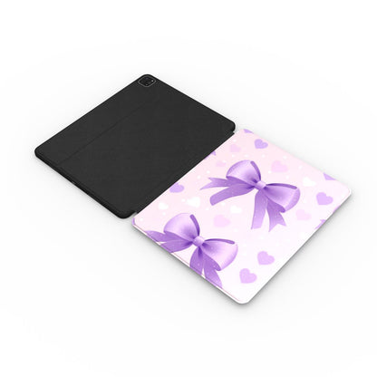 Lilac Bows & Hearts iPad case opened flat — printed front cover with plain black interior