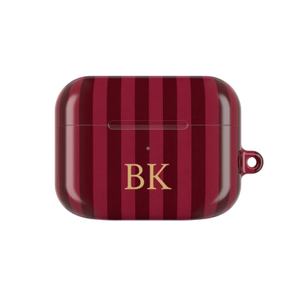 Burgundy Stripe monogram AirPods case — wine and burgundy stripes with gold serif initials