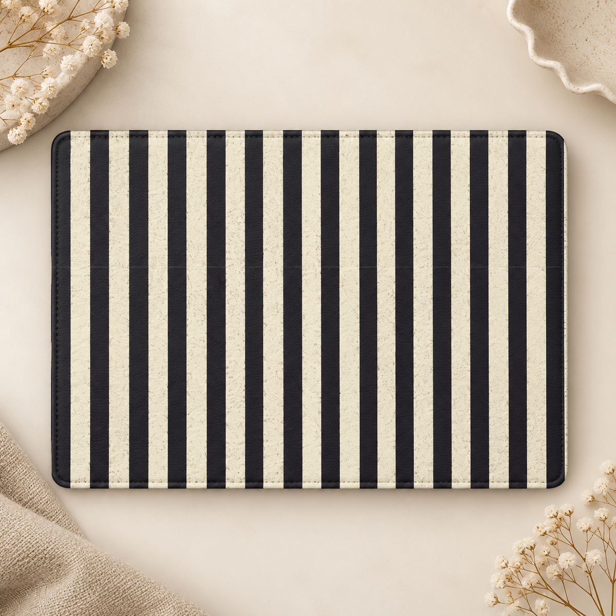 Black and Cream Stripe Kindle case opened flat, front and back — bold black and cream vertical stripes