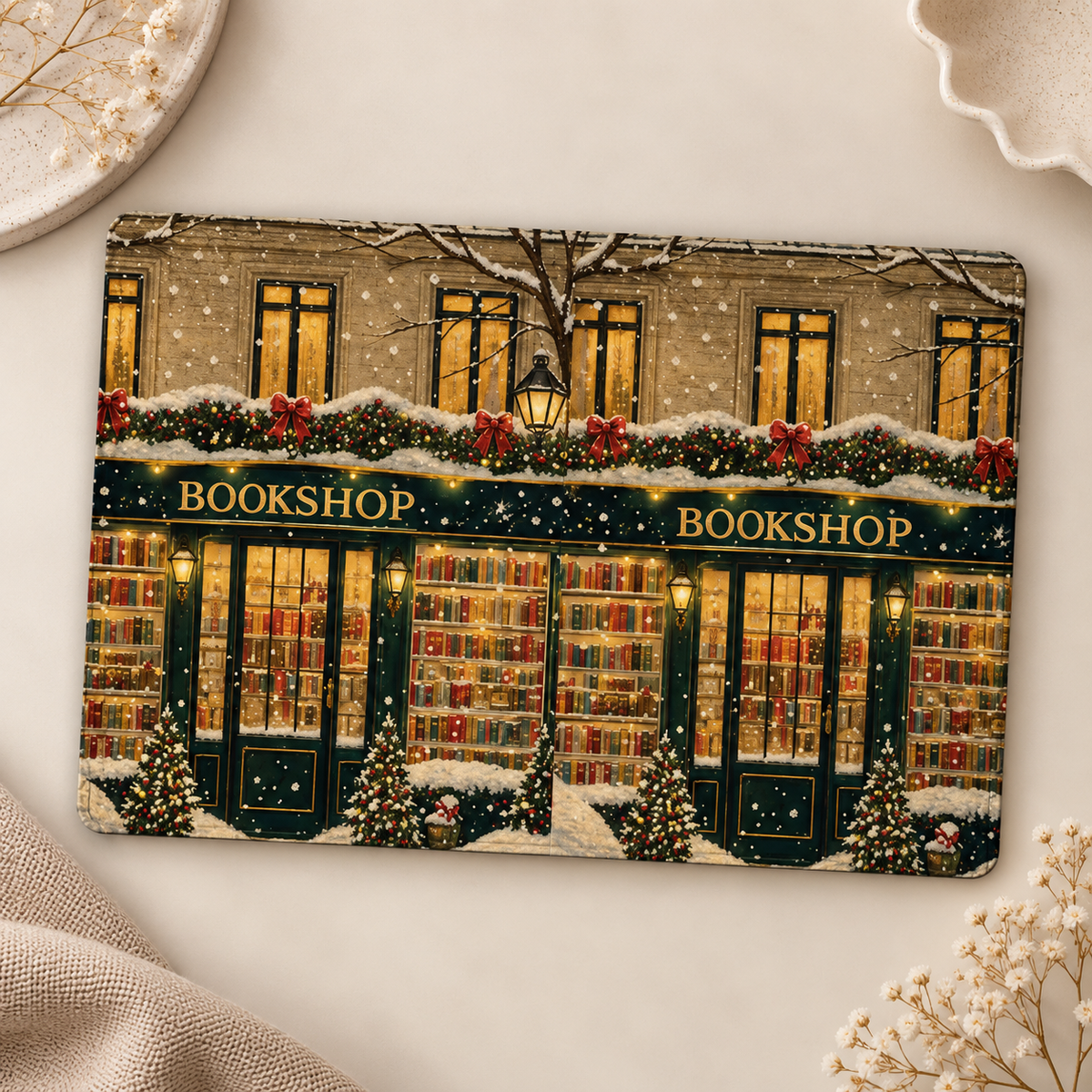 Christmas Bookshop Kindle case opened flat, front and back — snowy bookshop storefront with glowing windows