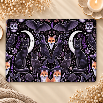 Witchy Woodland Kindle case opened flat — black cats, crescent moons, foxes in witch hats, owls and ravens