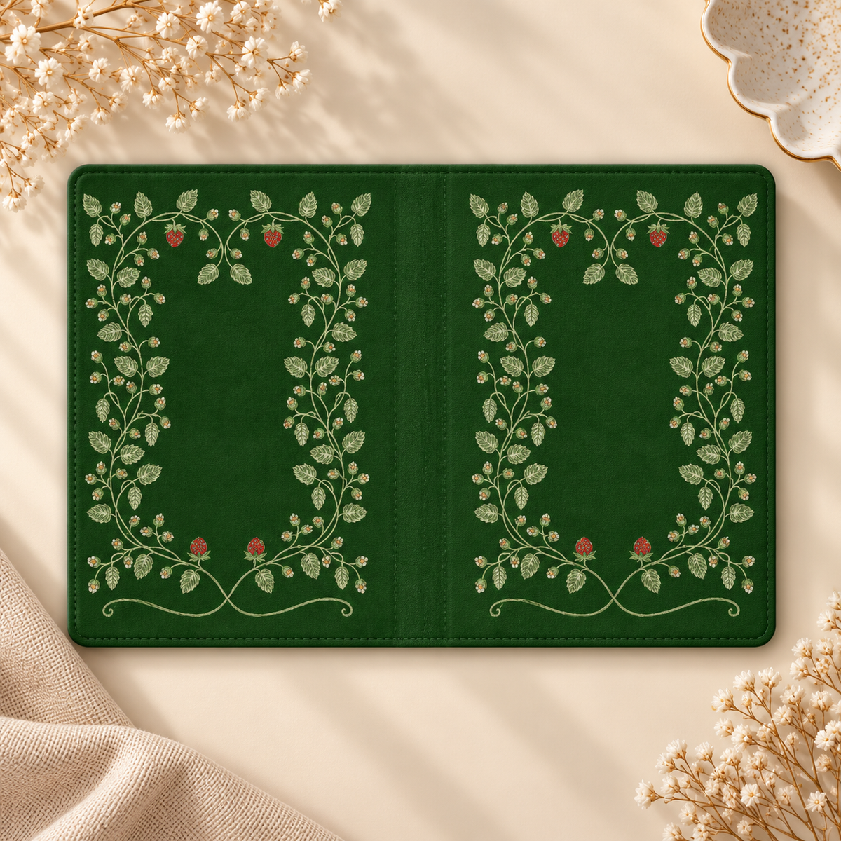 Hop Vine Wreath Kindle case opened flat, front and back — cream vine wreath with red berries on forest green