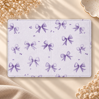 Lilac Bow Kindle case opened flat, front and back — watercolor purple bows on pale lilac
