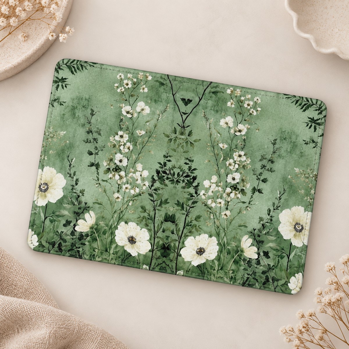 Sage Meadow Kindle case opened flat, front and back — white wildflowers and grasses on soft sage green