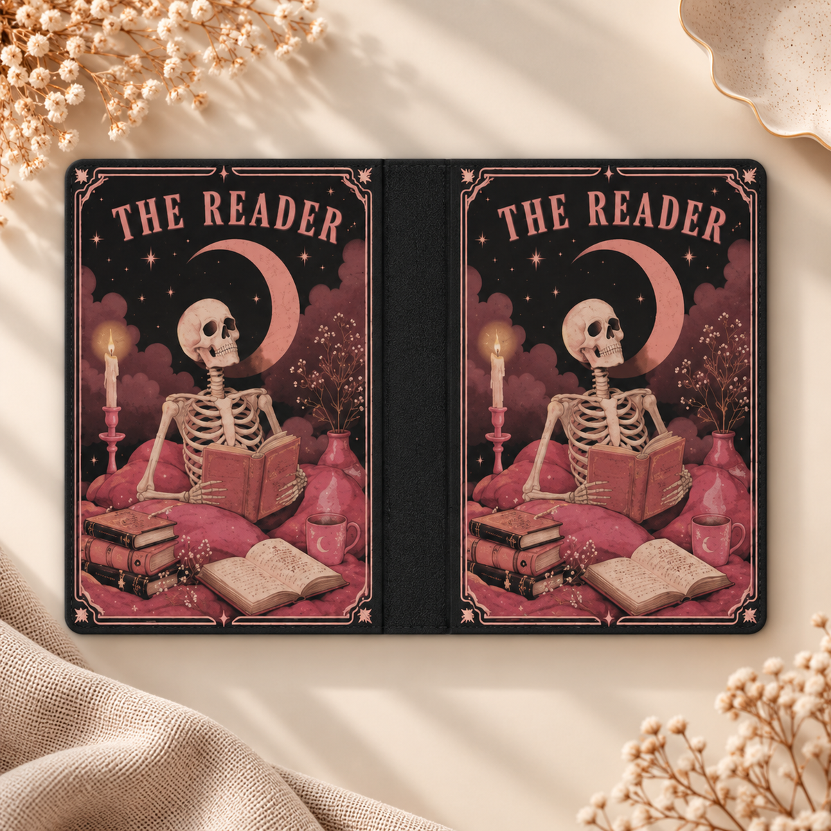 The Reader Tarot Kindle case opened flat, front and back — skeleton reading under a crescent moon, pink on black