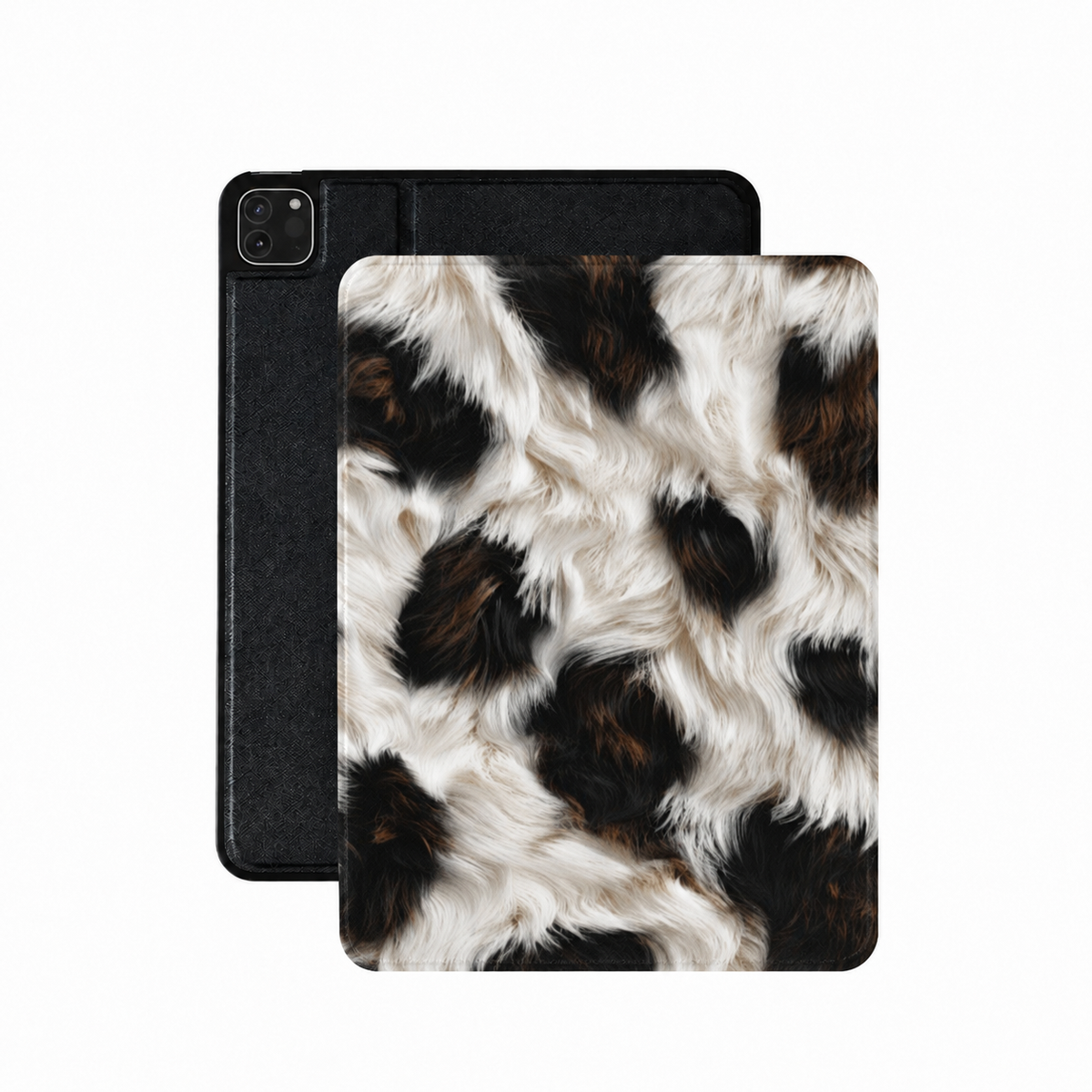 Black cowhide iPad case in high-contrast black, rust and cream cow print