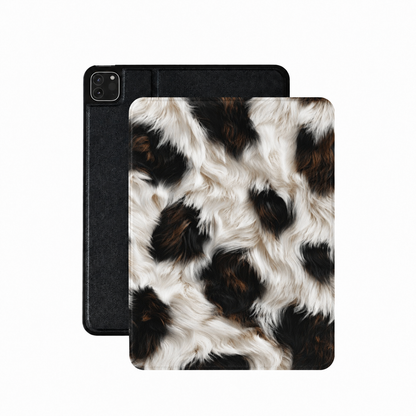 Black cowhide iPad case in high-contrast black, rust and cream cow print